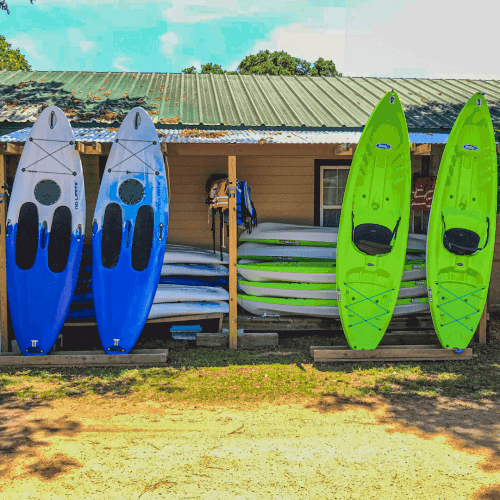 Image of standup paddle board and kayak rentals available daily for guests to use. These are the best lake activities in Texas out on Lake Buchanan